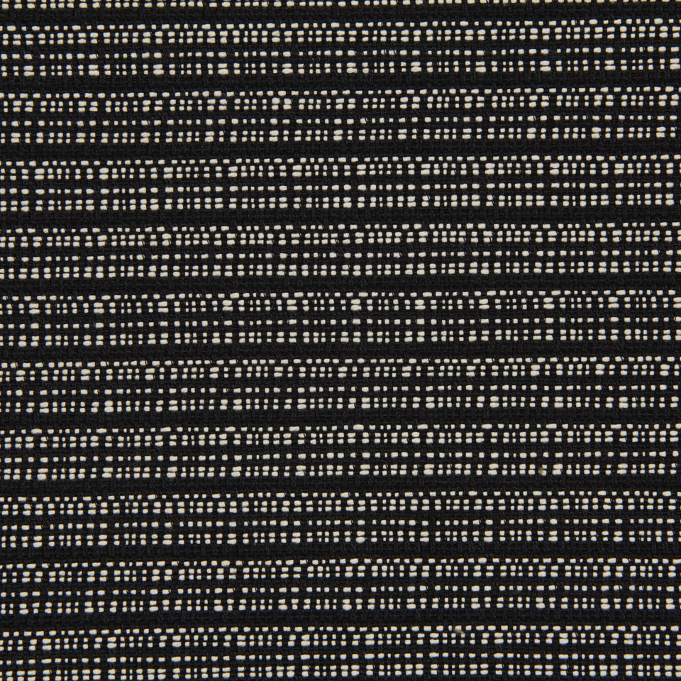 Black fabric with cream dotted horizontal stripes; textured woven knit suitable for apparel or upholstery.