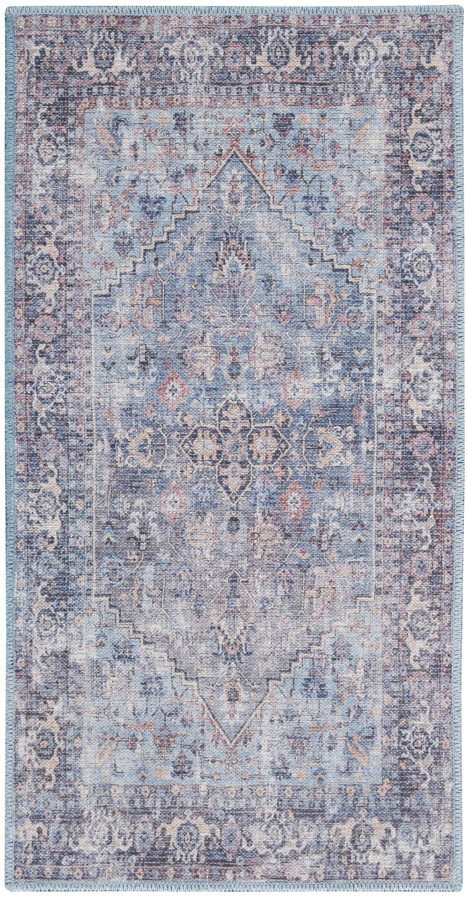 Blue-toned vintage oriental rug with central medallion, intricate floral border, distressed wash, fringed edges.
