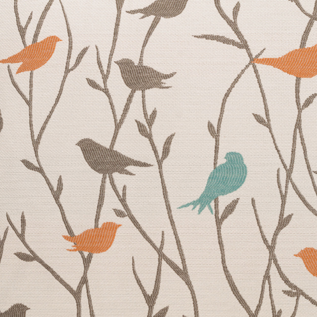 Beige woven pillow with brown branch vines and orange and turquoise birds in a nature-inspired pattern.
