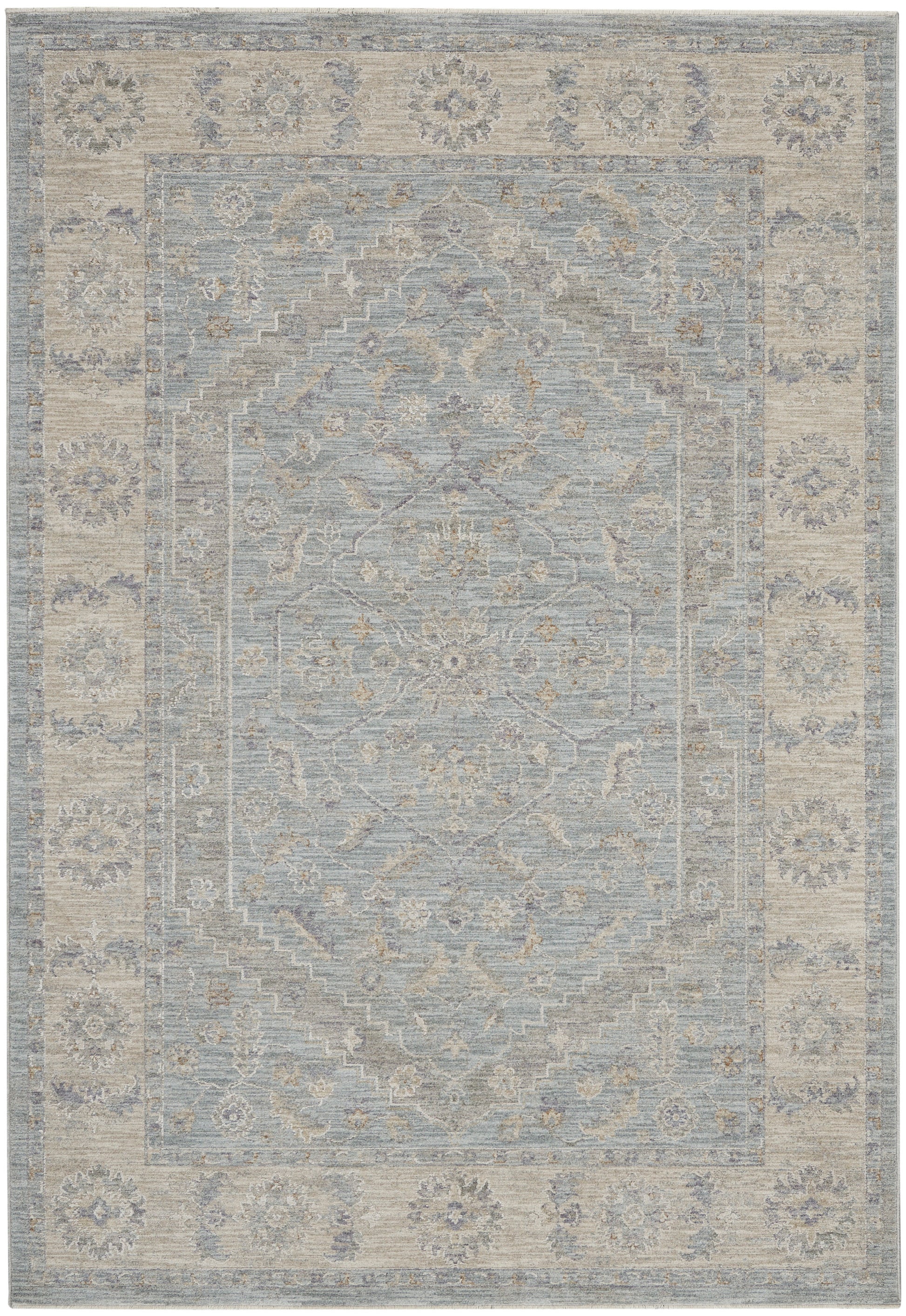 Muted blue-gray oriental rug with beige floral medallion center and ornate border, distressed vintage finish.