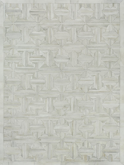 Natural hide indoor hand-stitched rug with subtle texture.