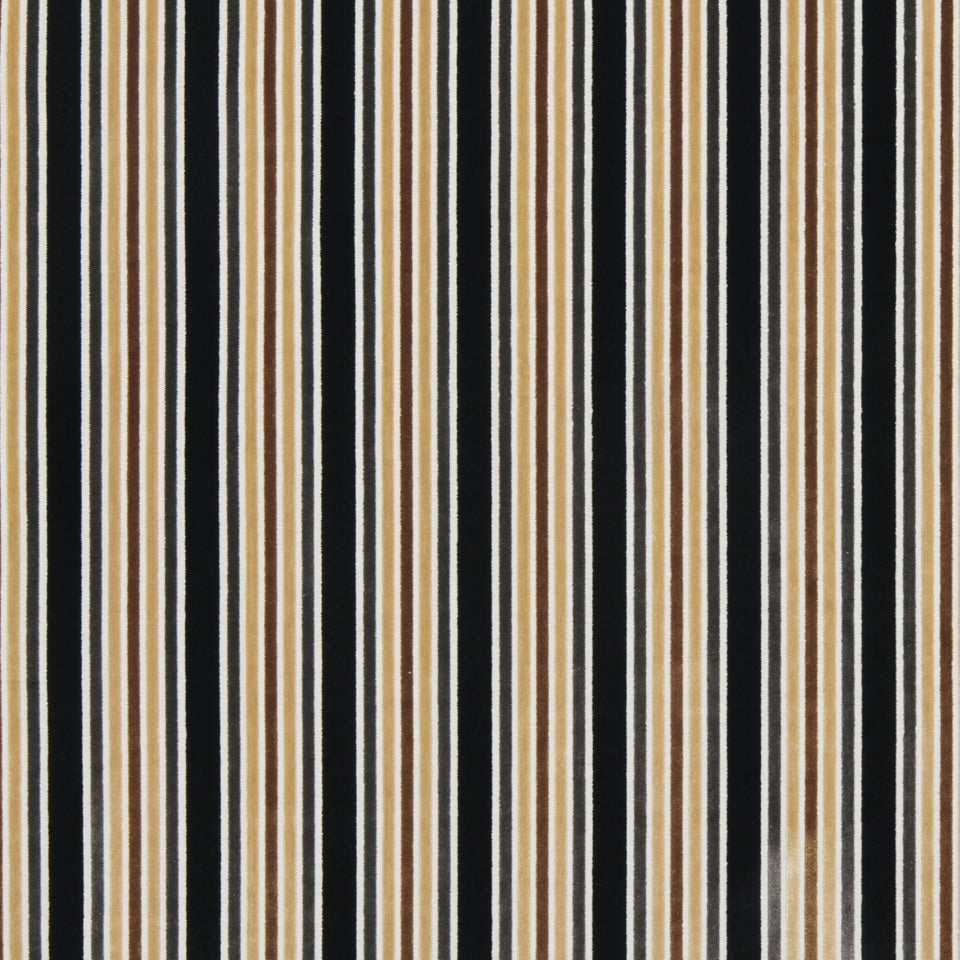 Vertical stripes in black, tan and white on upholstery fabric; bold stripe pattern.