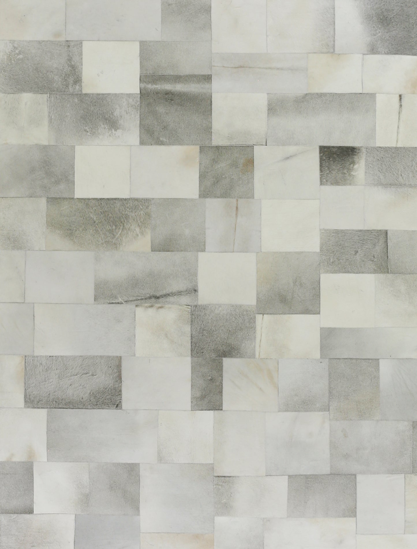 Natural hide indoor rug; hand-stitched; 5' x 8'.