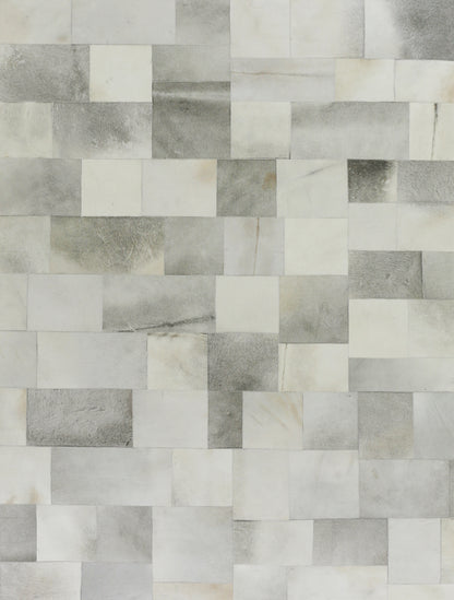 Natural hide indoor rug; hand-stitched; 5' x 8'.