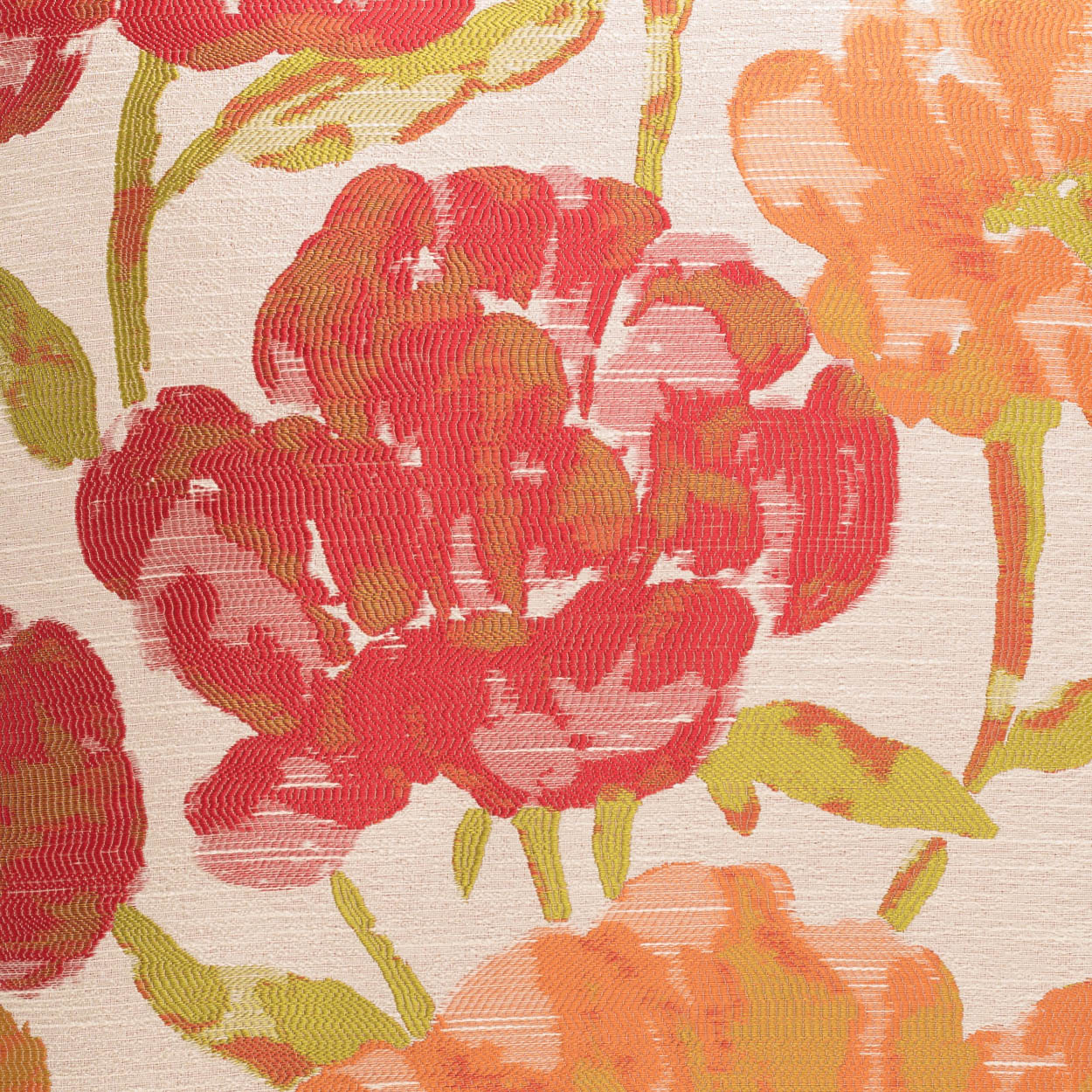 Close-up of floral print on fabric with large red, pink, and orange flowers and green stems on a pale background.