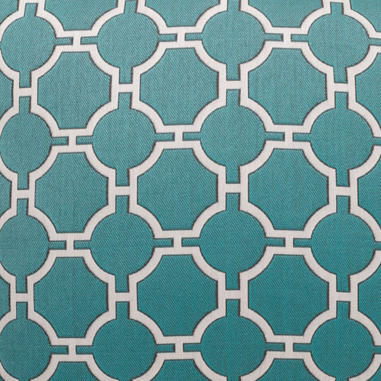 Teal woven fabric with white interlocking circle lattice pattern; geometric upholstery textile.