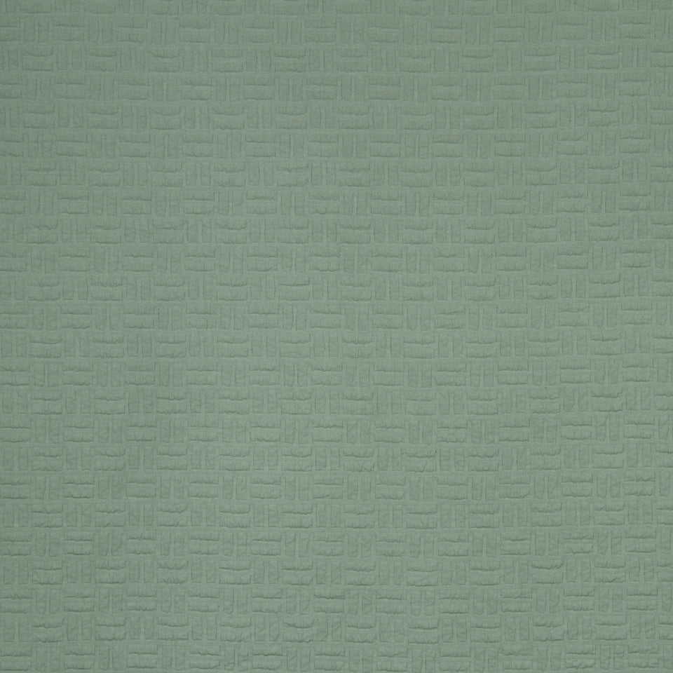 Sage green textured fabric with a subtle geometric woven pattern.
