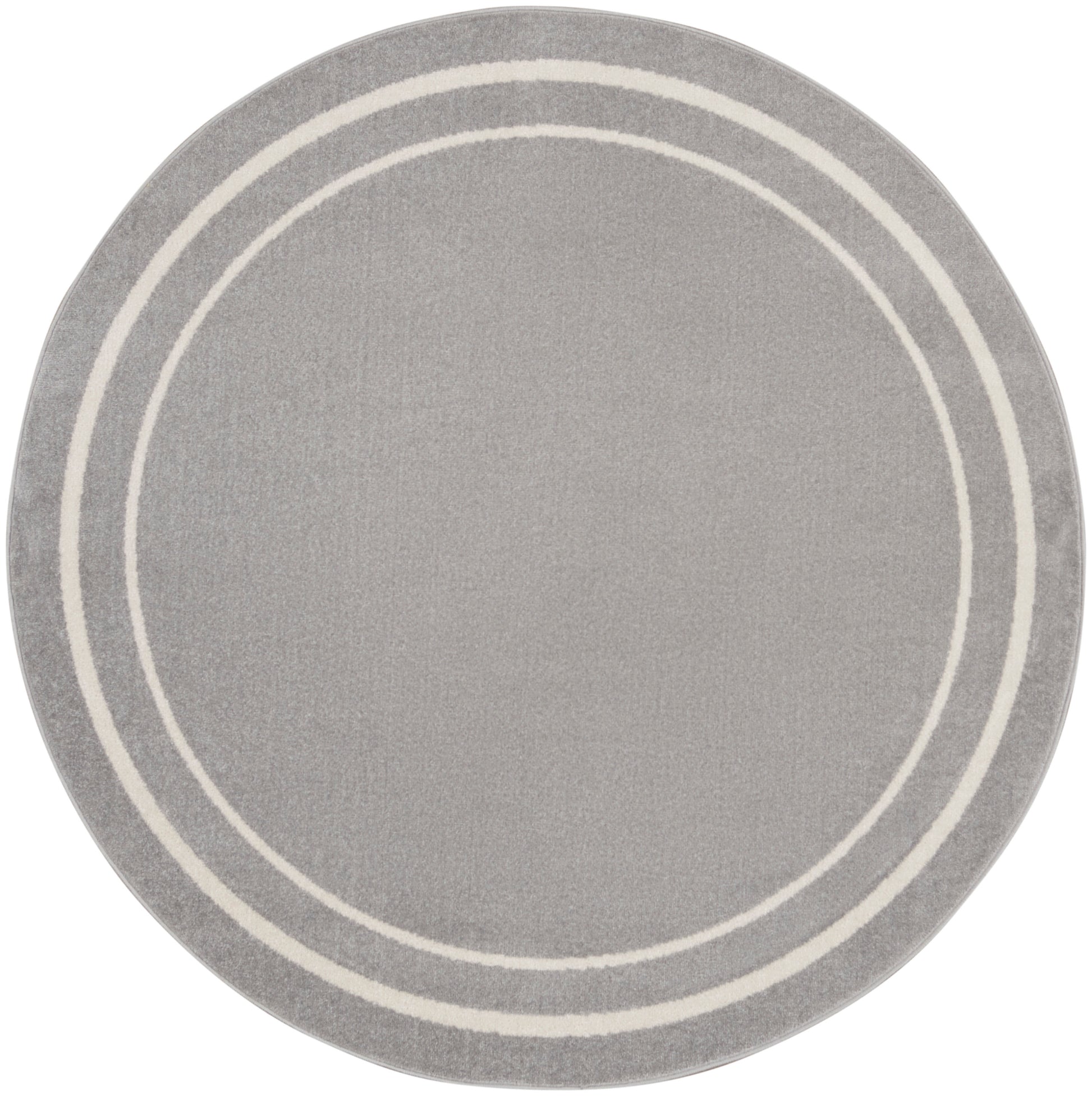 Round gray rug with two white concentric rings along the border; modern minimalist circular rug.