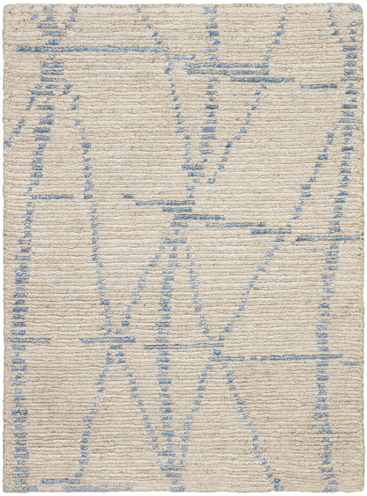 Beige woven rug with pale blue geometric lines in an abstract pattern; soft, textured surface.