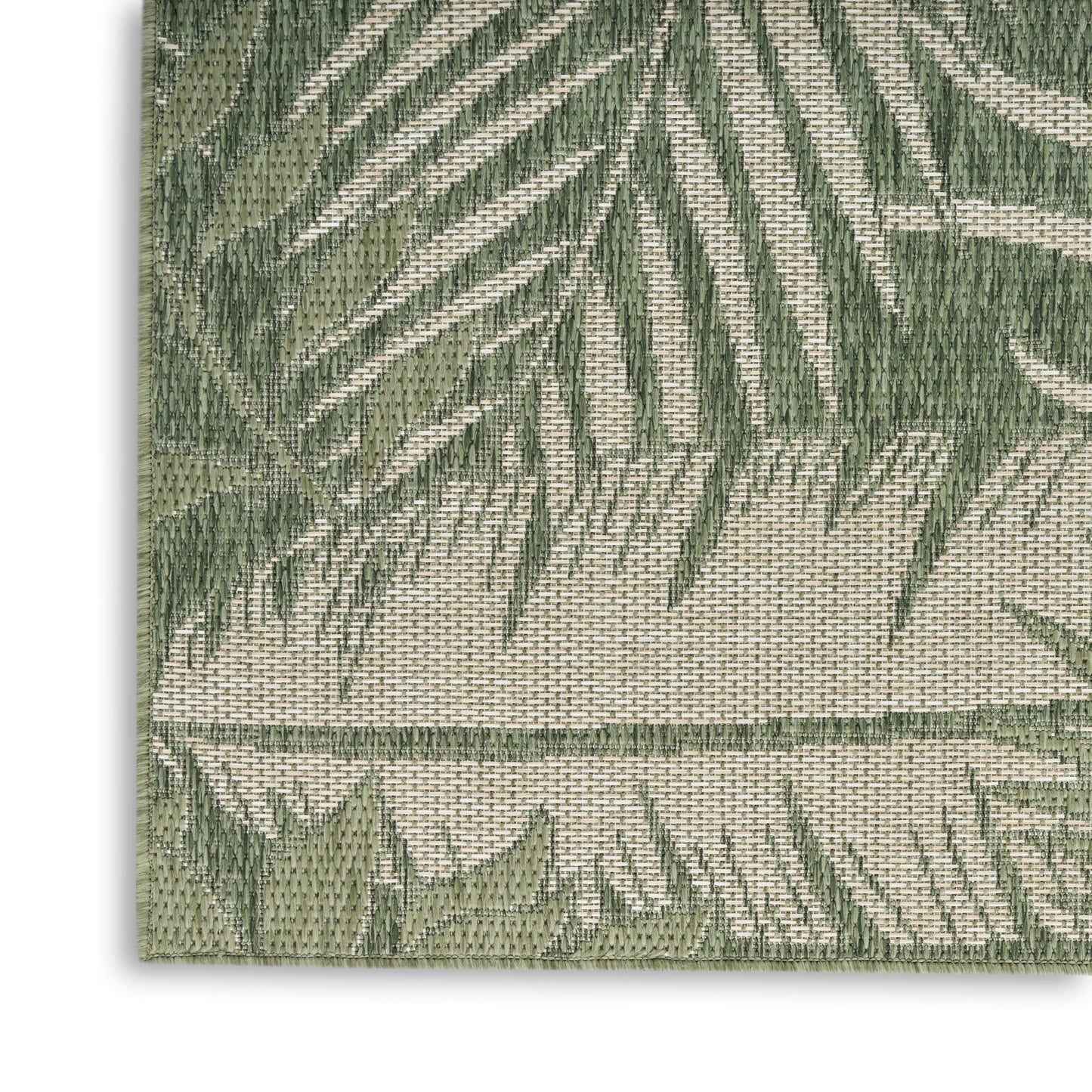 Woven area rug with green palm leaf pattern on beige background, textured fabric.