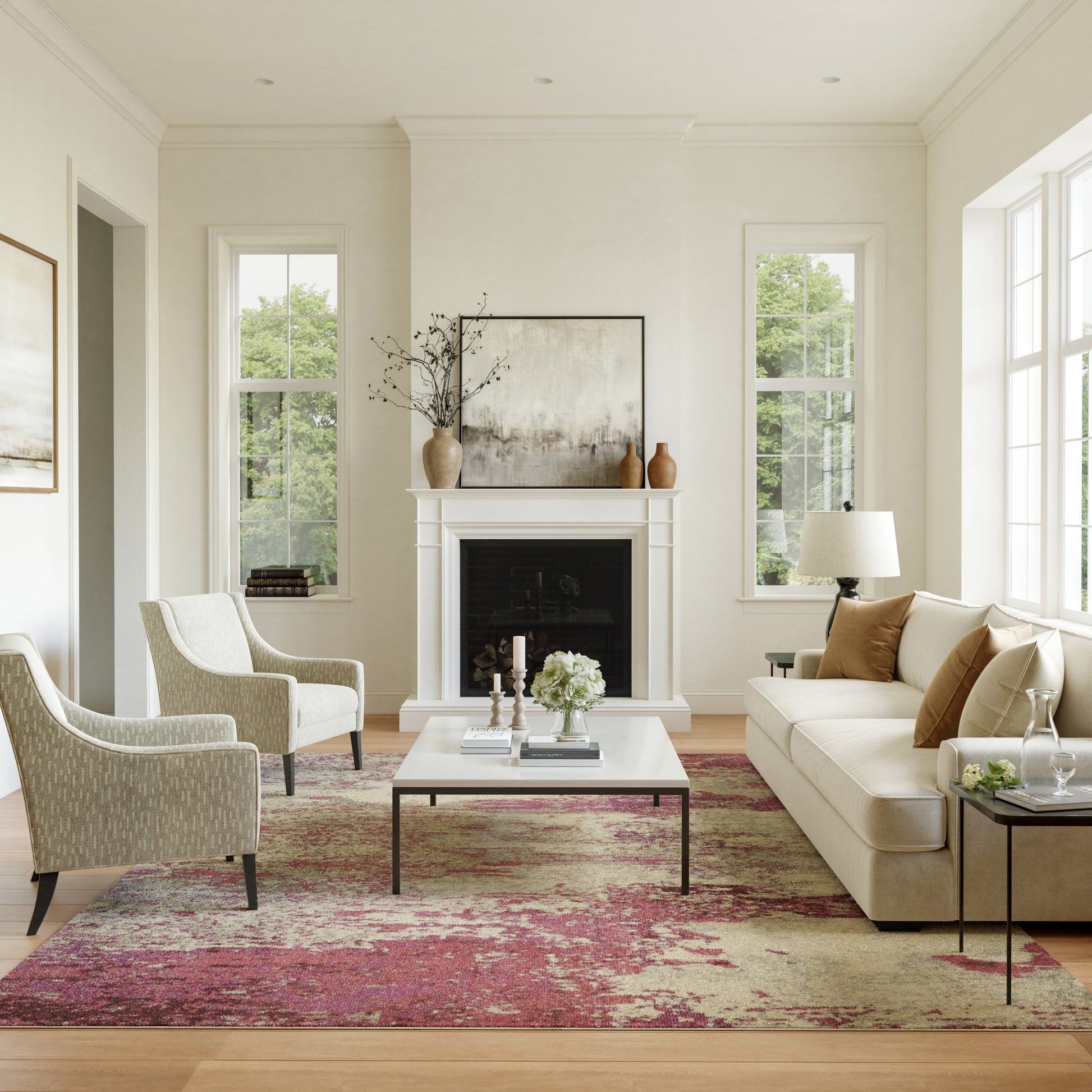 Bright living room with white walls, beige sofa, patterned chairs, white coffee table, red rug, fireplace.