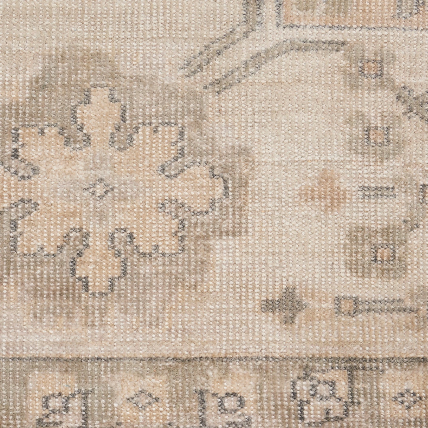 Neutral beige distressed Persian-style rug with taupe floral motif, woven texture, versatile for living room decor.