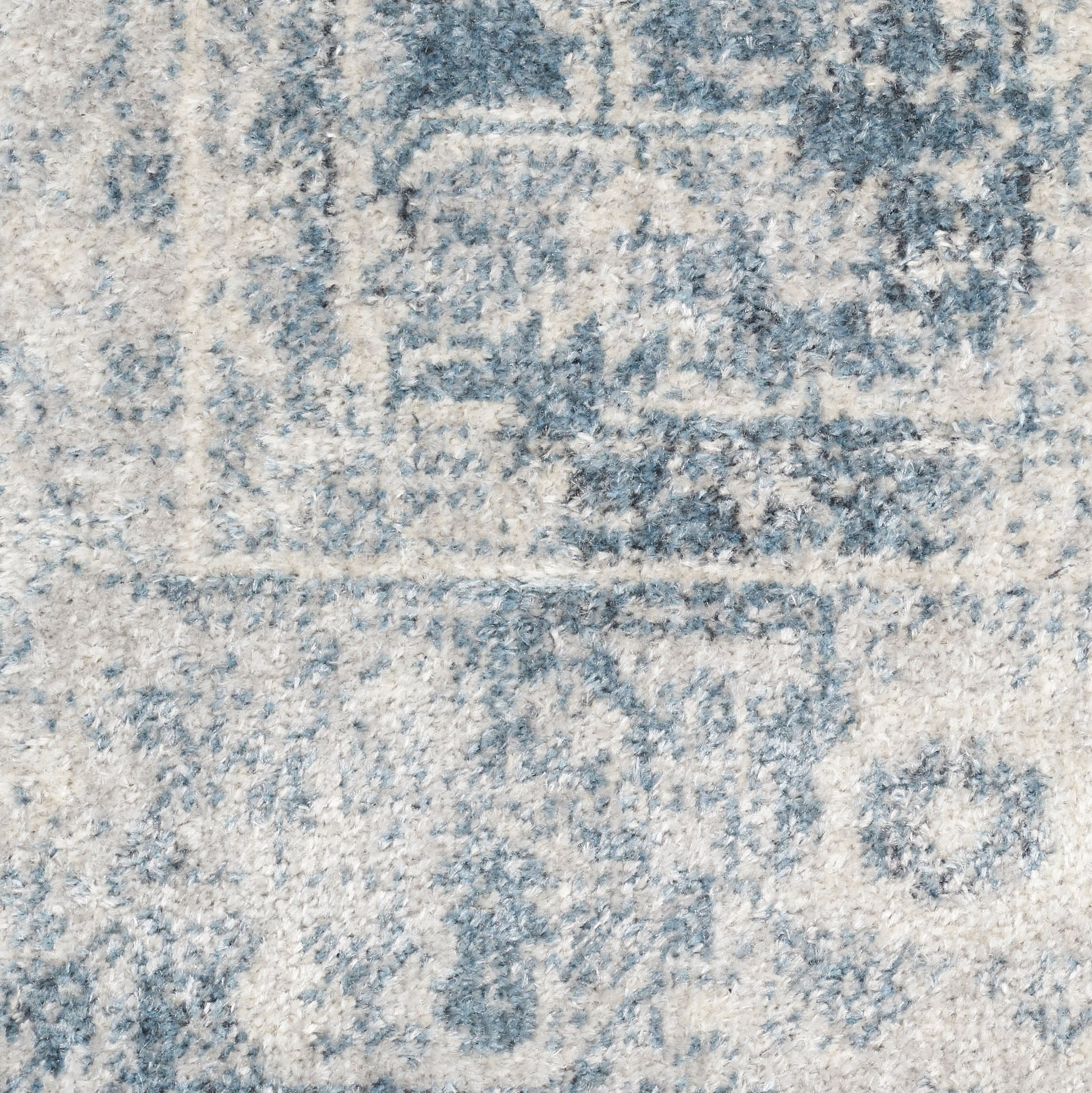 Blue & cream distressed runner rug with faded medallion pattern & soft textured pile.