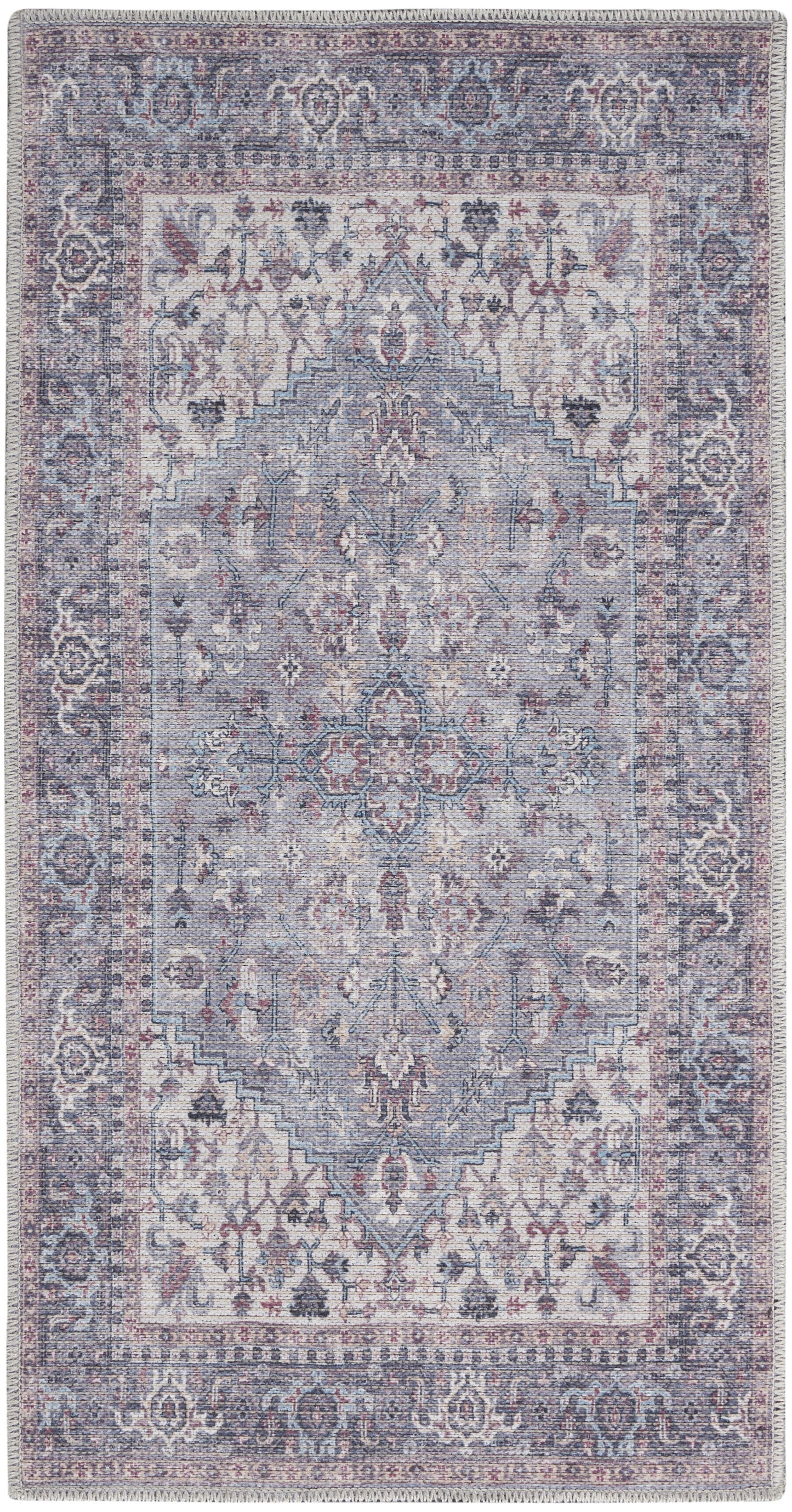 Rectangular distressed vintage oriental rug in muted blues, lavender and ivory with central medallion and ornate border.