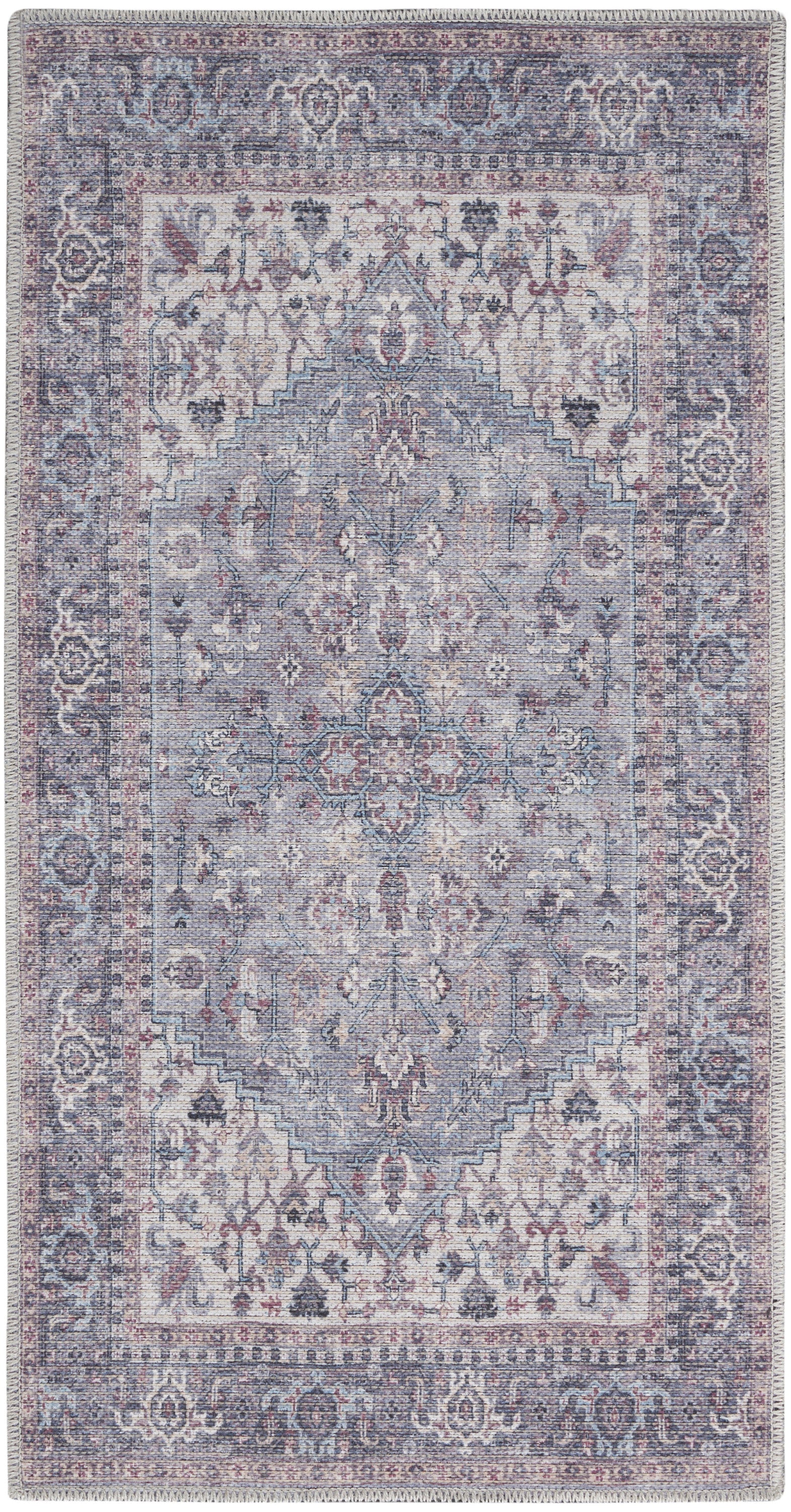 Rectangular distressed vintage oriental rug in muted blues, lavender and ivory with central medallion and ornate border.