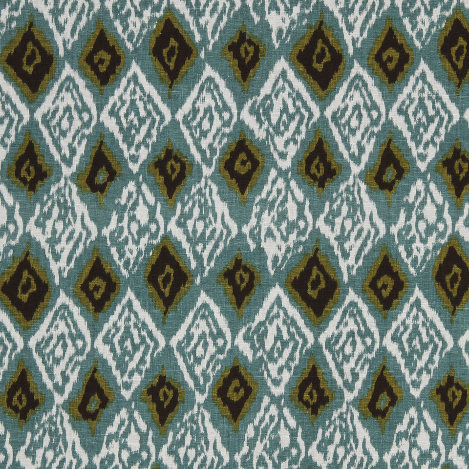 Teal and white diamond ikat pattern with olive diamond accents on woven fabric.