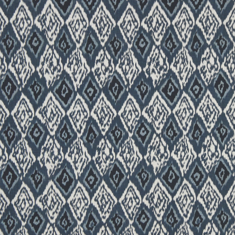 Dark blue and white diamond ikat textile with a repeating geometric pattern; ideal for upholstery or rugs.