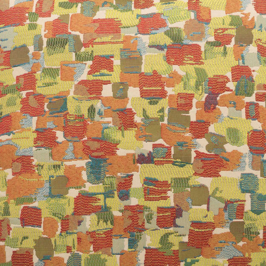 Abstract multicolor brush-stroke fabric pattern with red, yellow, green, blue and orange blocks; textile texture.