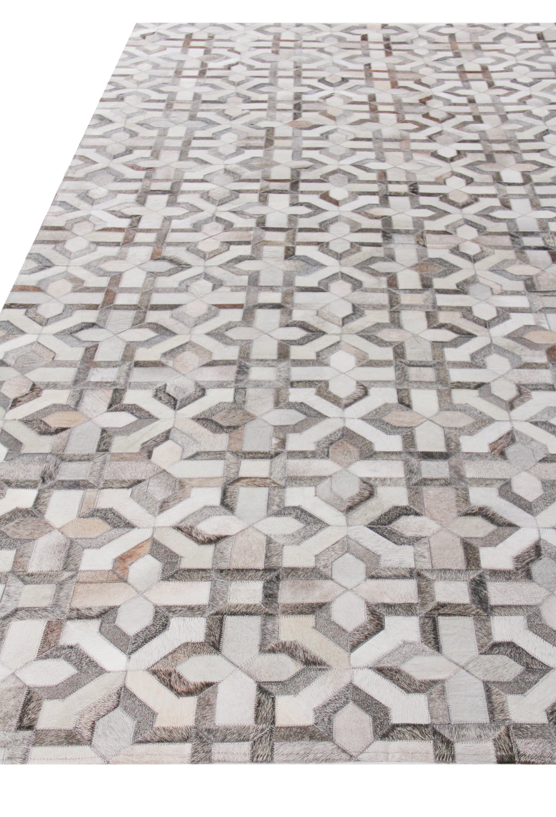 Natural hide indoor hand-stitched rug with geometric pattern featuring interlocking star and cross motifs in white, gray and beige.