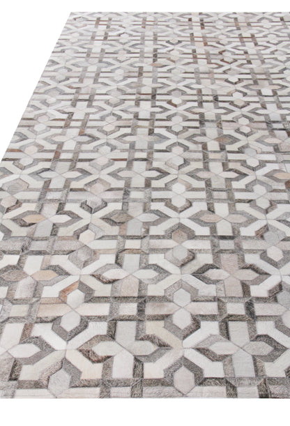 Natural hide indoor hand-stitched rug with geometric pattern featuring interlocking star and cross motifs in white, gray and beige.