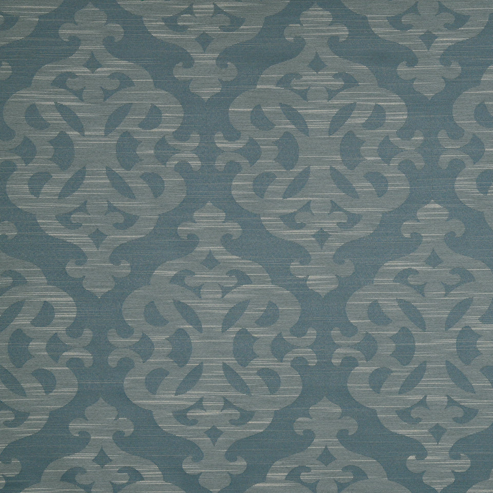 Teal blue damask patterned wallpaper with light blue scrolling ornamental motifs.