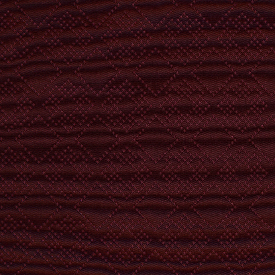 Dark burgundy upholstery fabric with a subtle dot pattern and a textured jacquard look.