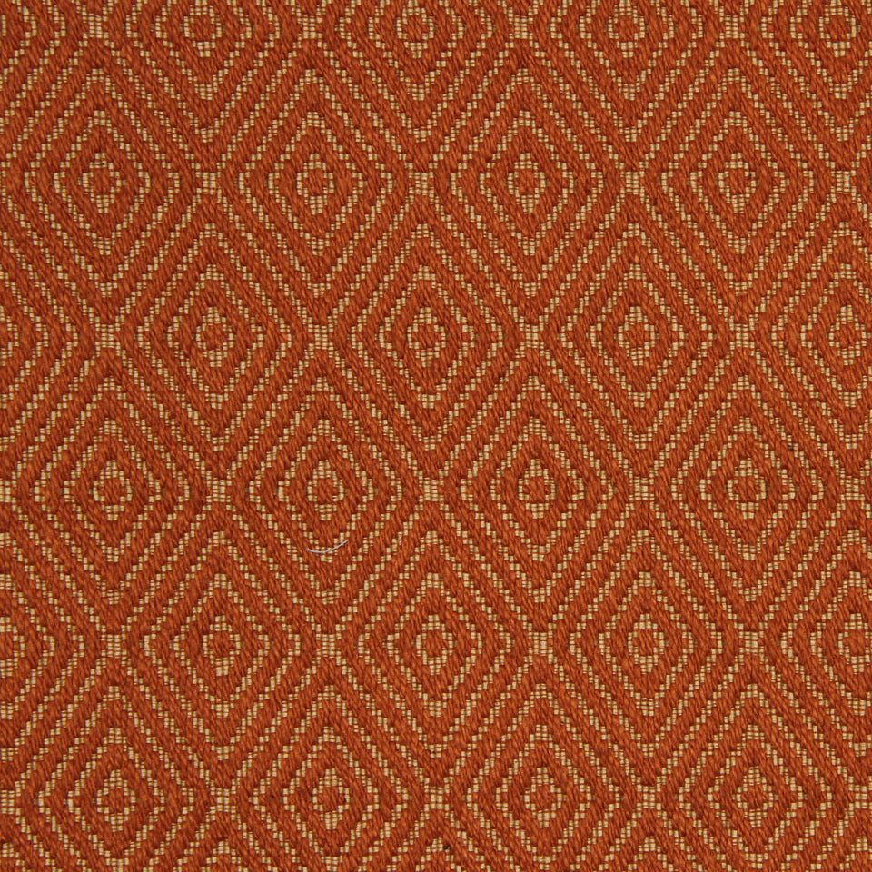 Rust-orange woven fabric with cream diamond lattice pattern; geometric textile for upholstery or decor