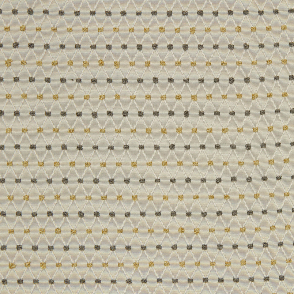 Beige fabric with gray and gold dotted lattice pattern; delicate geometric texture for curtains or upholstery.