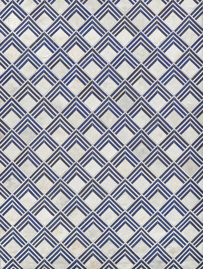 Blue and white diamond pattern on a natural hide rug; indoor hand-stitched.