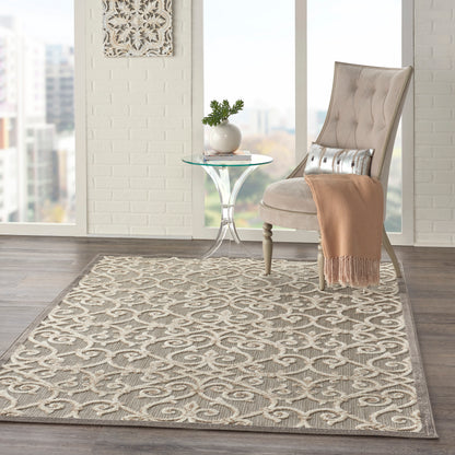 Beige patterned rug in a bright loft setting.