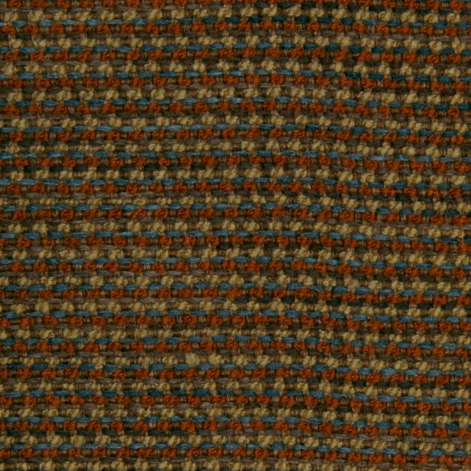 Close-up of brown, rust and blue woven tweed fabric with a rug-like texture.