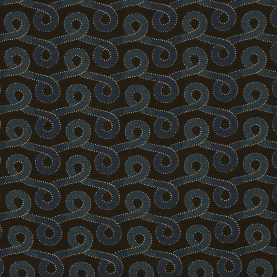Dark brown fabric with teal spiral motifs and tan dotted outlines forming a repeating retro scroll pattern.