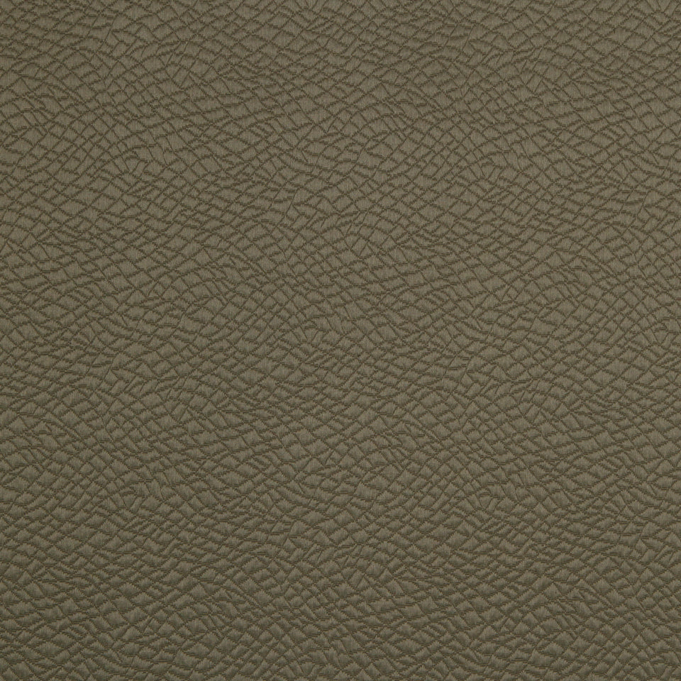 Brown leathergrain texture with pebble pattern on upholstery fabric.