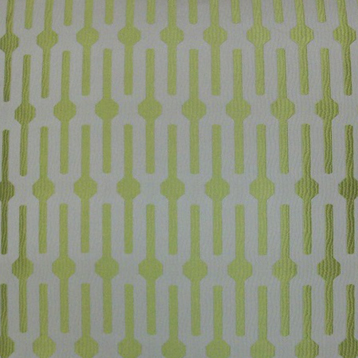 Lime green geometric repeating pattern on white fabric; vertical linked shapes for upholstery or crafts.