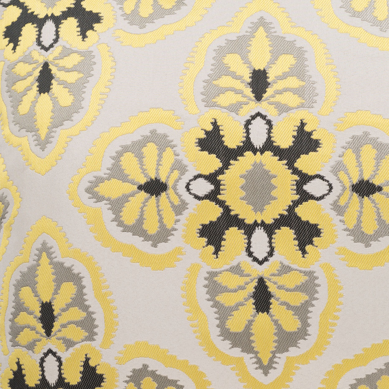 Damask-style fabric with yellow, gray & black ornamental medallions on pale beige.