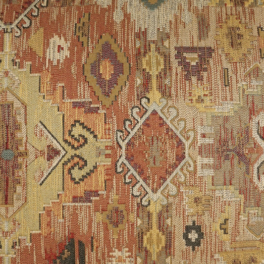 Earth-toned kilim rug with diamond medallions in red, orange, tan and cream; woven geometric tribal pattern.