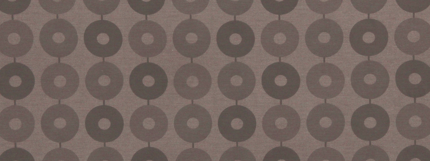 Dark chocolate fabric with a repeating donut-circle pattern; retro geometric upholstery textile.