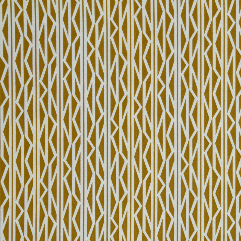 Geometric chevron pattern in tan and white with repeating zigzag lines, suitable for upholstery fabric.