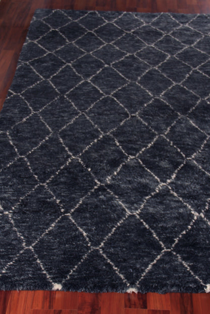 Dark navy Moroccan indoor hand-knotted rug with white diamond pattern, rectangular living room area rug.