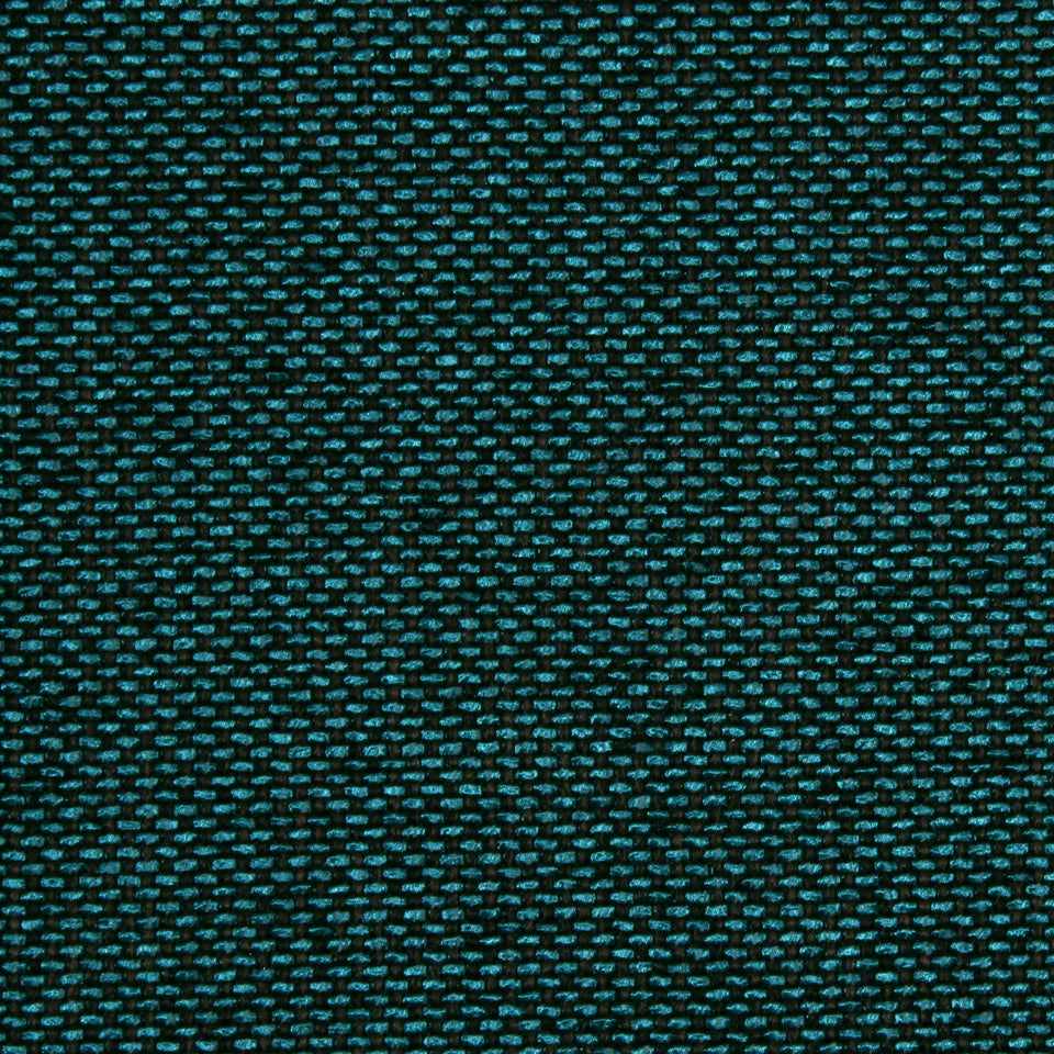 Close-up of dark fabric with teal specks; fine woven texture and tiny speckled pattern.