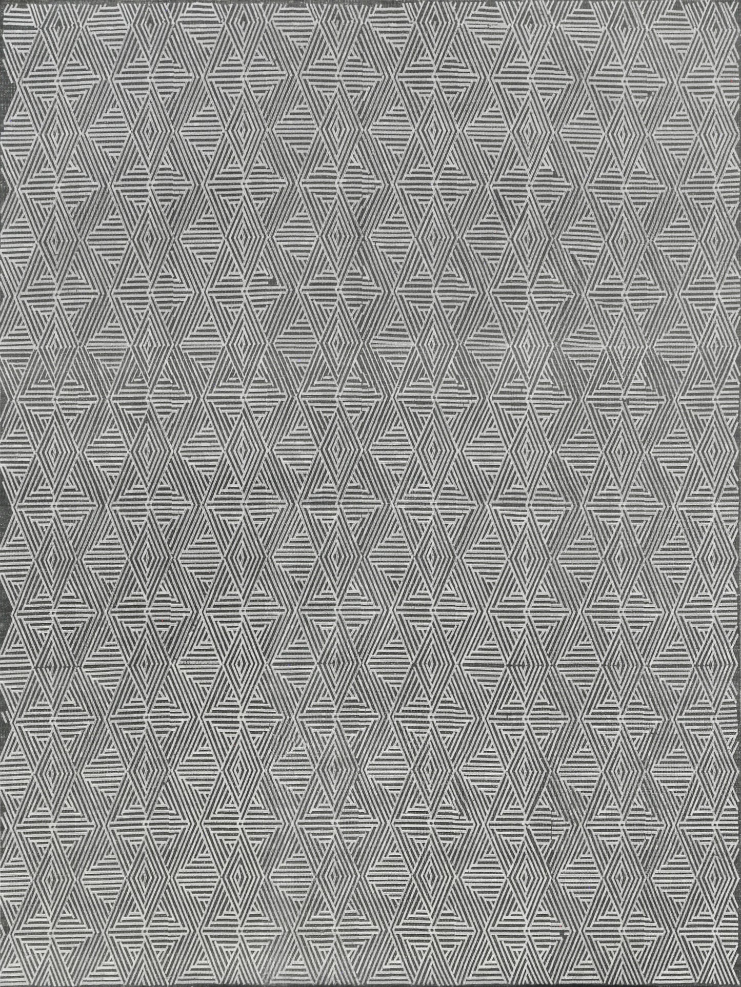 Grey flat-weave rug with a white repeating diamond and triangle pattern; indoor use.