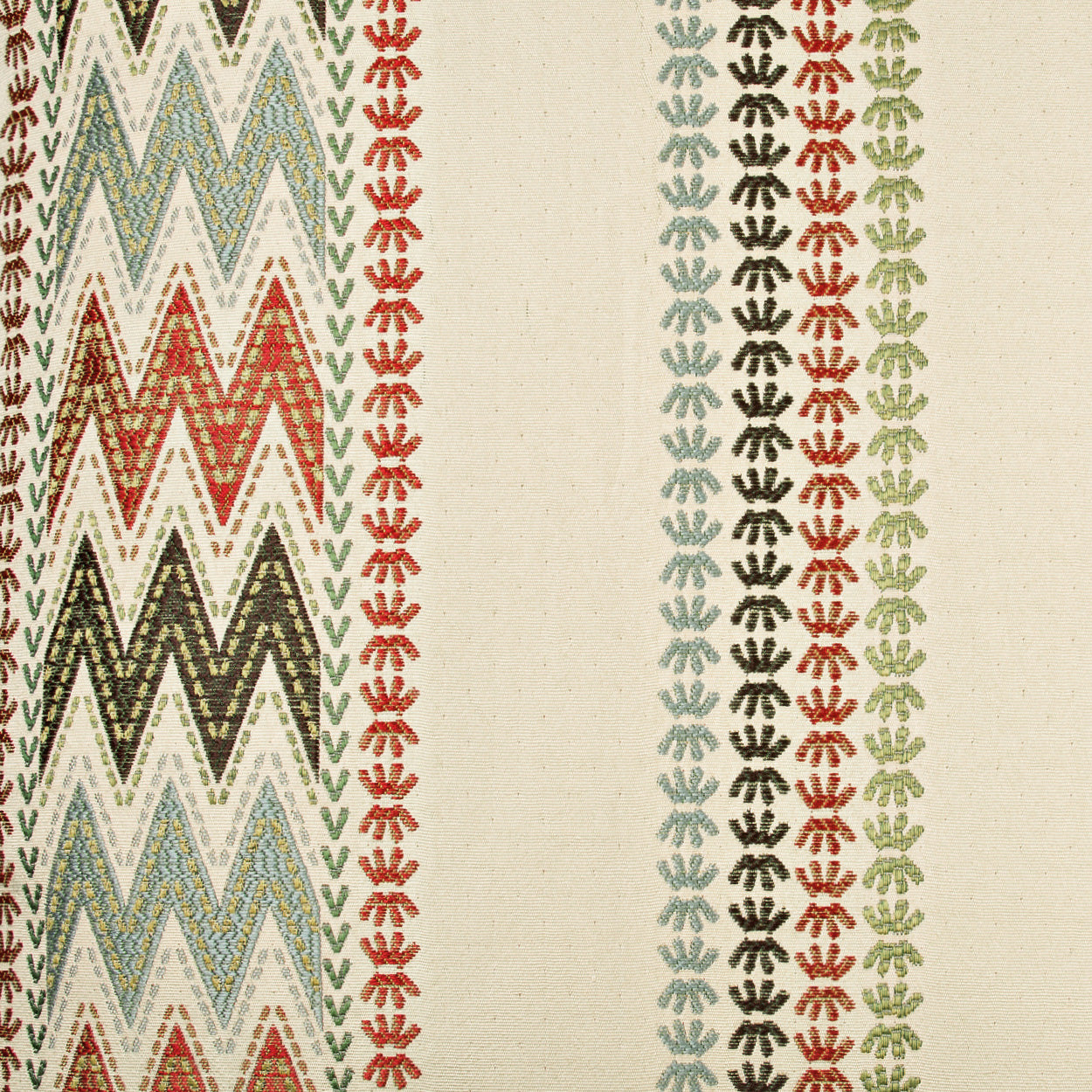 Beige fabric with multicolored chevron zigzags on the left and vertical rows of star-like motifs in red, green, blue-gray, and black.