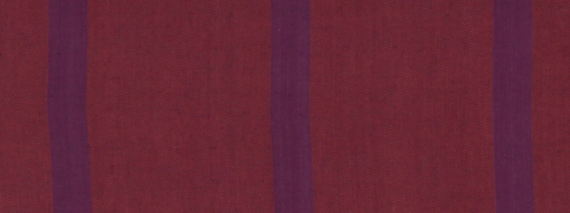 Maroon fabric with vertical magenta stripes; textured textile suitable for upholstery or fashion accents.