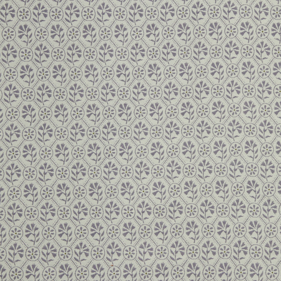 Muted gray-lavender background with repeating dark floral clusters and leafy stems pattern.