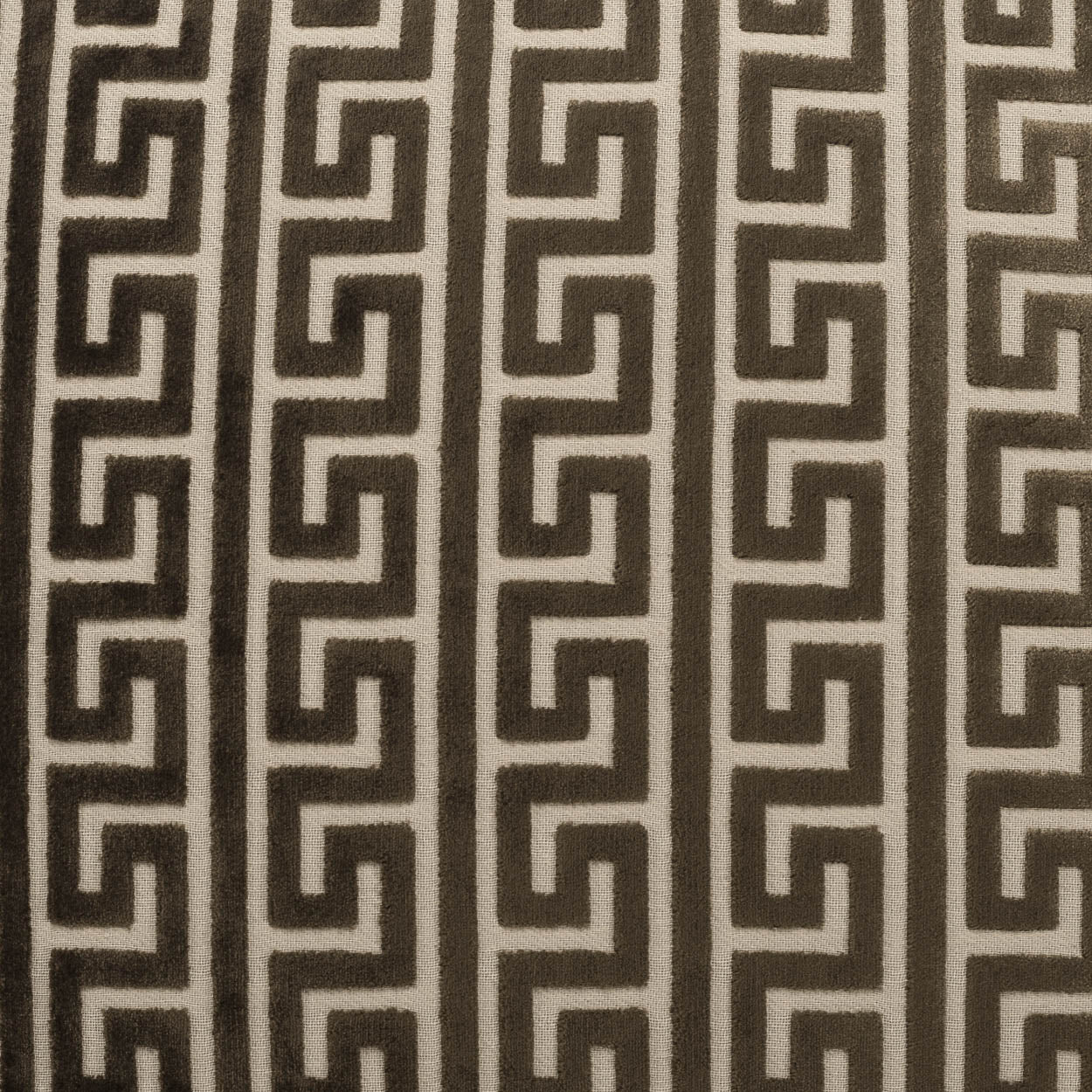 Beige fabric with repeating dark brown Greek key meander pattern in vertical stripes.