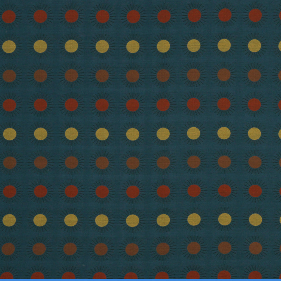 Teal fabric with a grid of orange and yellow dotted circles, each with a subtle sunburst motif.