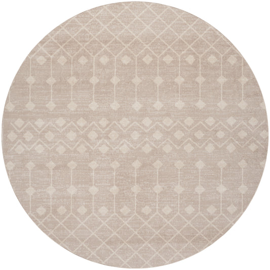 Round beige rug with subtle white geometric diamond lattice pattern and soft woven texture.