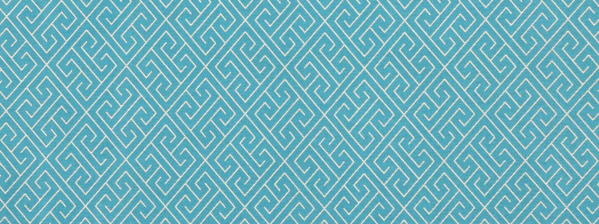 Turquoise upholstery fabric with a repeating white Greek key meander pattern.