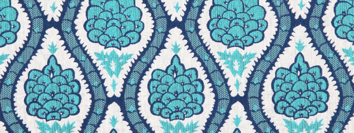 Repeating turquoise & navy damask pattern with teal floral clusters in a trellis design.