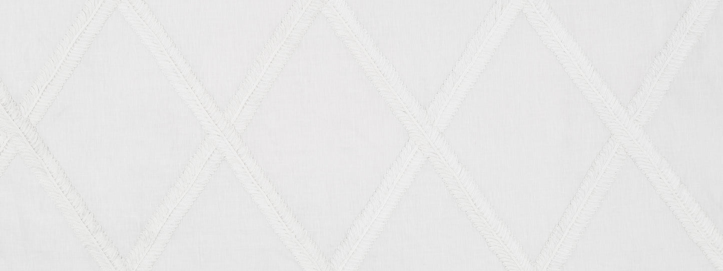 White quilted fabric with diagonal diamond stitching pattern; soft textile suitable for bedding or upholstery.
